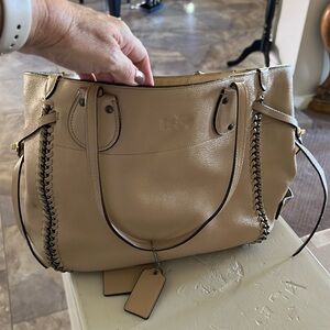 Coach purse. Tan. Lightly used. Adorable metal detail.